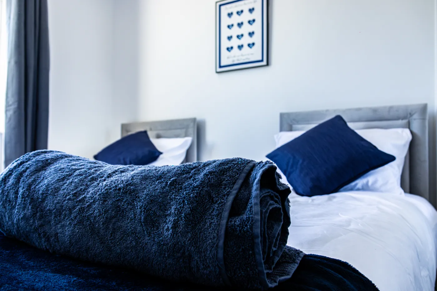 Twin bedroom in a Trade Nest Stays serviced house — set up for working crews